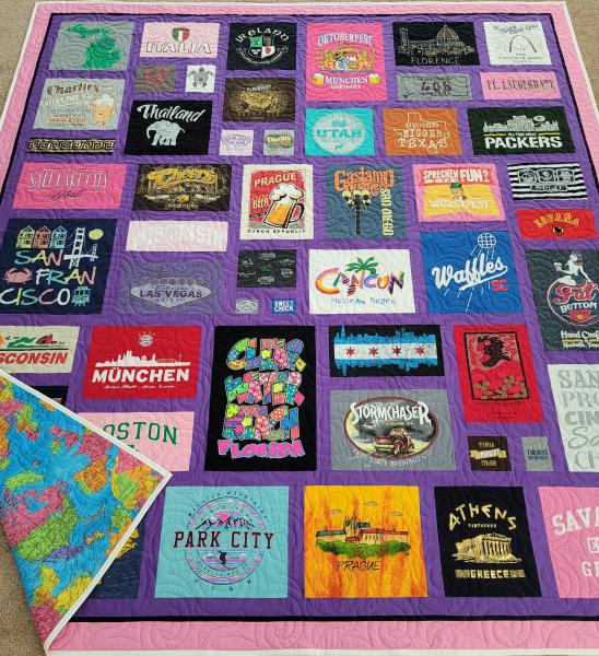 Mosaic T-shirt Quilt with Fabric in Between the T-shirt squares.