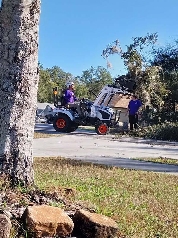 Hauling away brush and debris during a clearing job