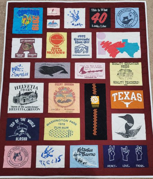 Mosaic T-shirt Quilt with Fabric in Between the T-shirt squares.