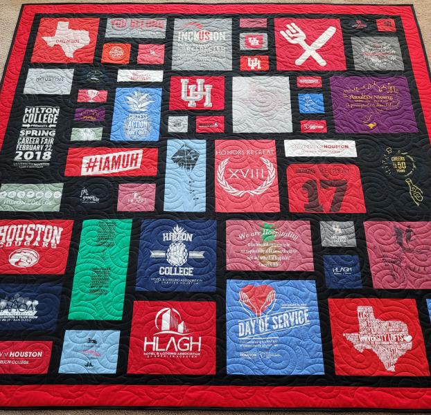 Mosaic T-shirt Quilt with Fabric in Between the T-shirt squares.