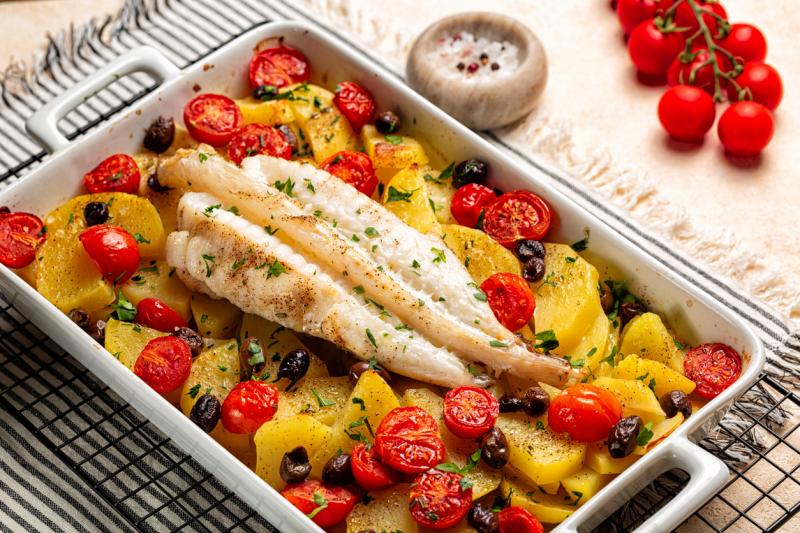 A great recipe for monkfish or tilapia with garlic, tomatoes, mushrooms, and white wine