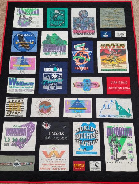 Mosaic T-shirt Quilt with Fabric in Between the T-shirt squares.
