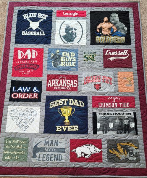 Mosaic T-shirt Quilt with Fabric in Between the T-shirt squares.