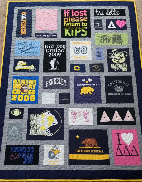 Mosaic T-shirt Quilt with Fabric in Between the T-shirt squares.